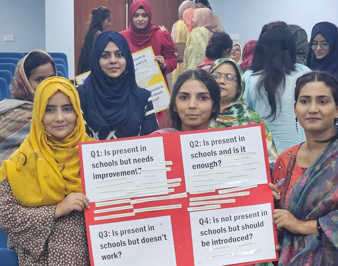 women holding up a poster