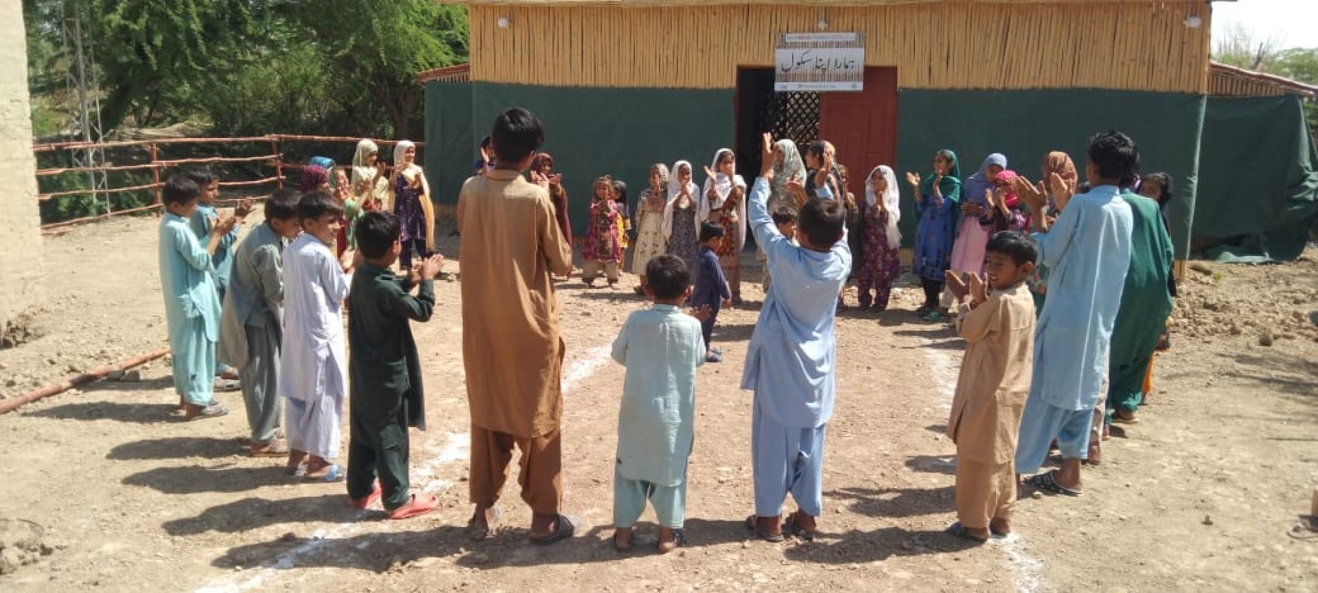 group of people outside taking part in workshop 