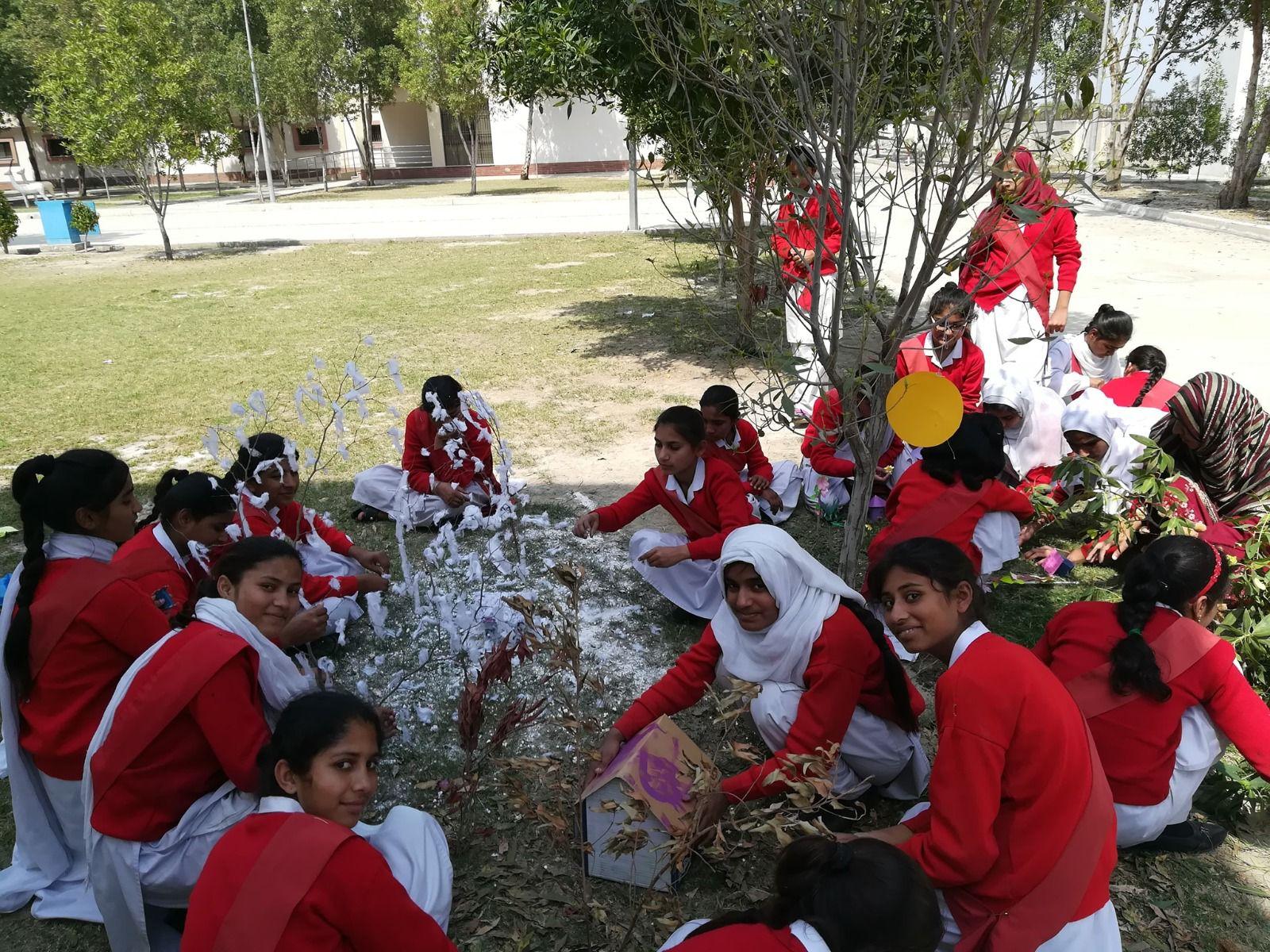 students doing a group outdoor workshop on school grounds